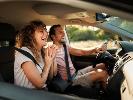 happy couple in new car