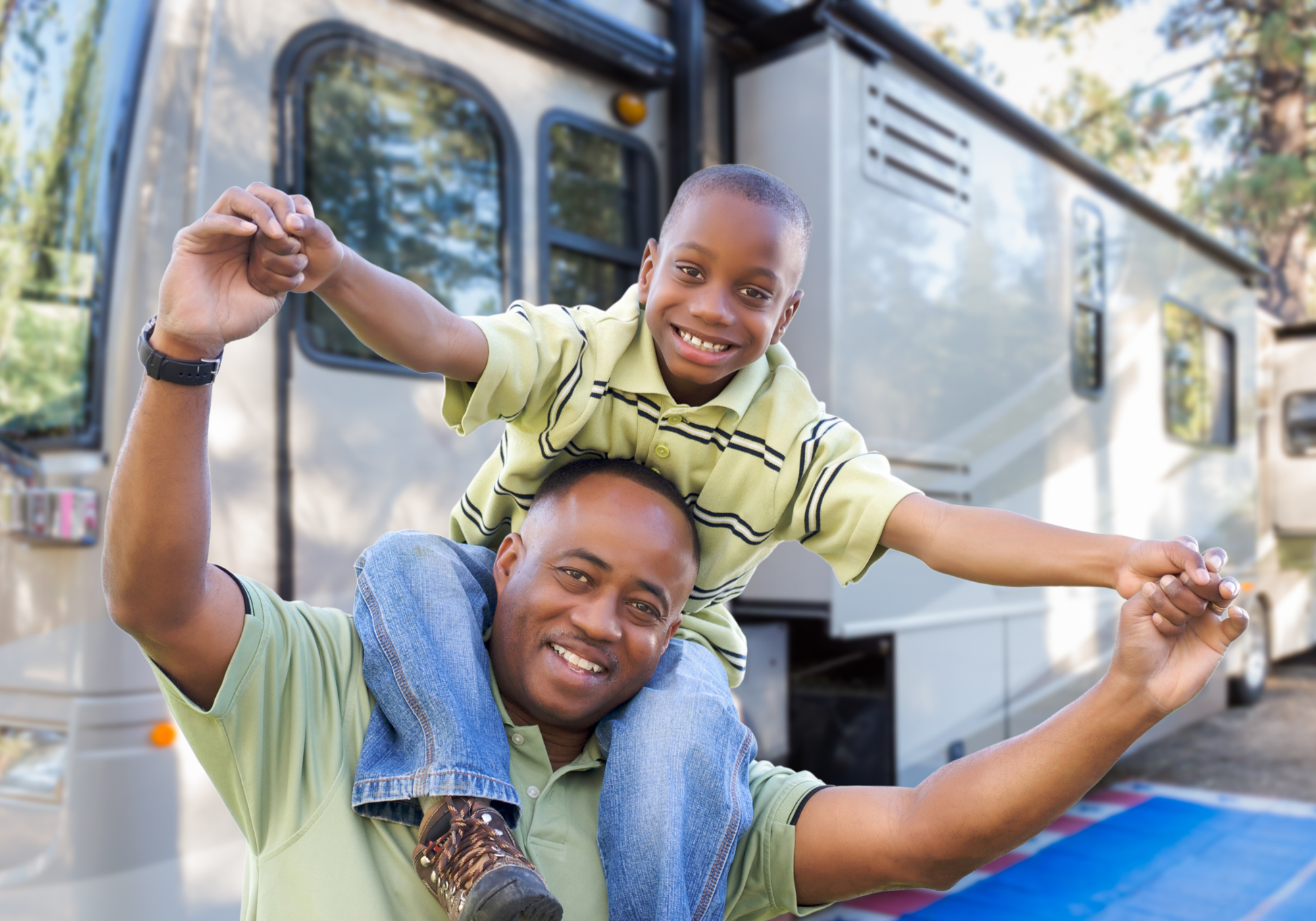 father and son camping with RV 