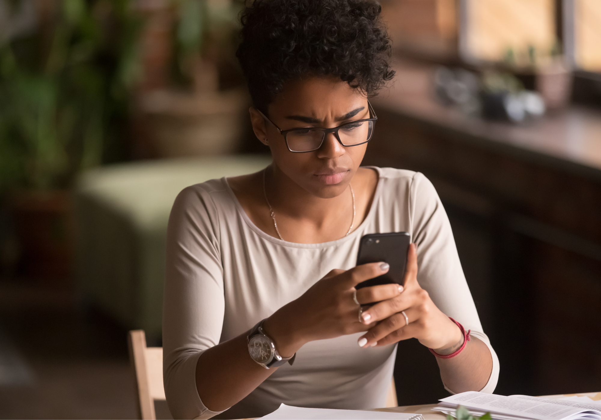 woman receiving a text scam 