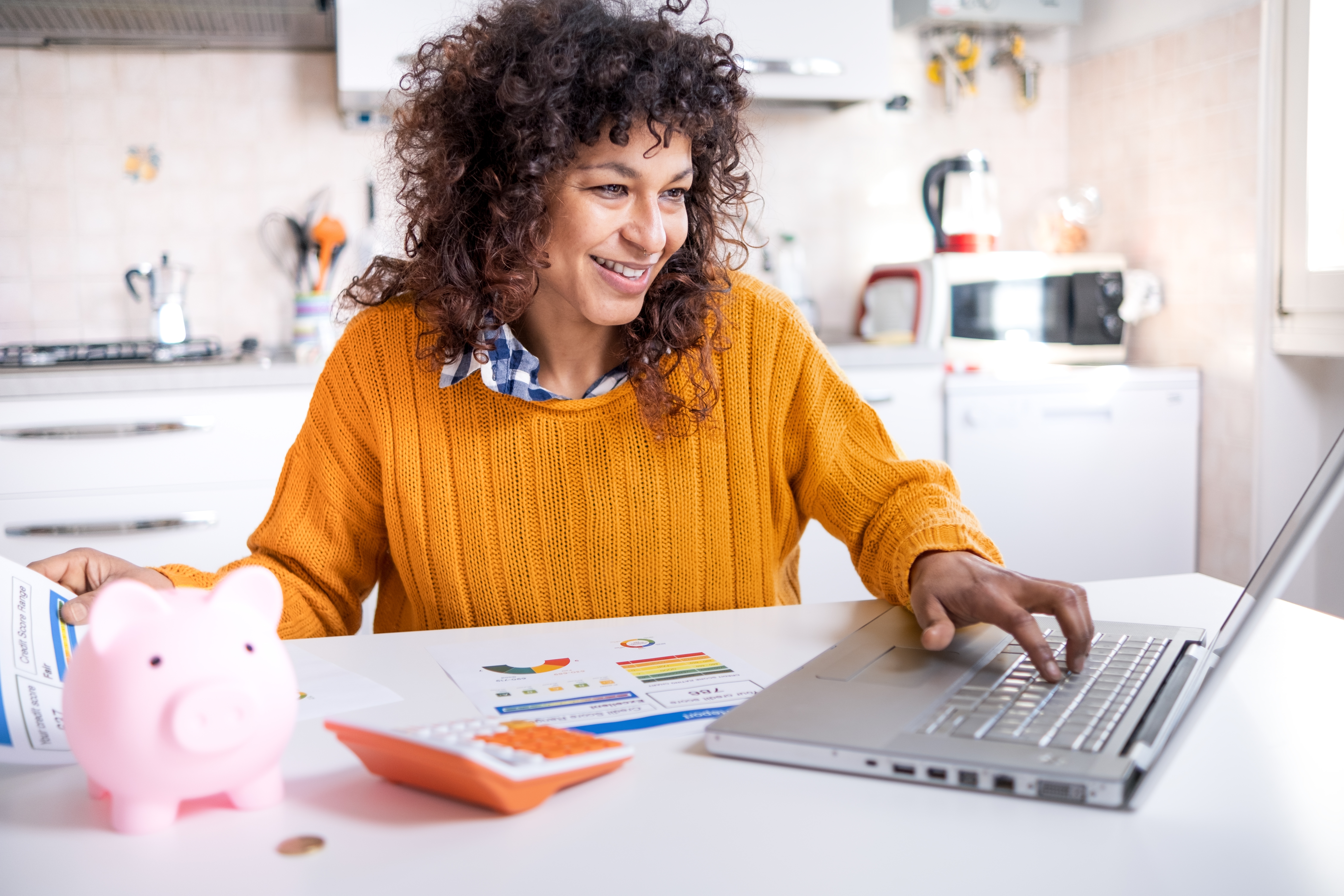 Woman checking credit score on laptop